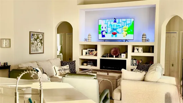 a kitchen with stainless steel appliances a stove microwave and refrigerator