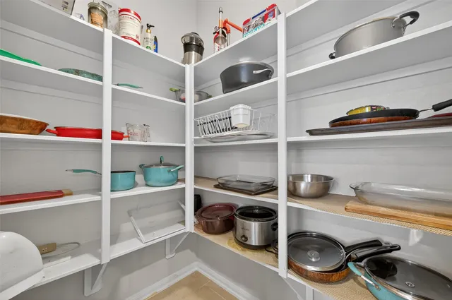a shelf with cup and plates