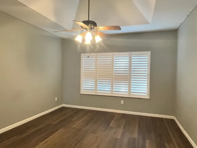 a kitchen with granite countertop a refrigerator stove and microwave