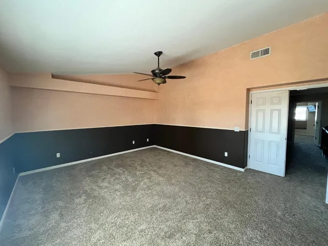 a view of walk in closet with clothes
