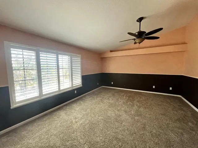 a view of room with window and bathroom