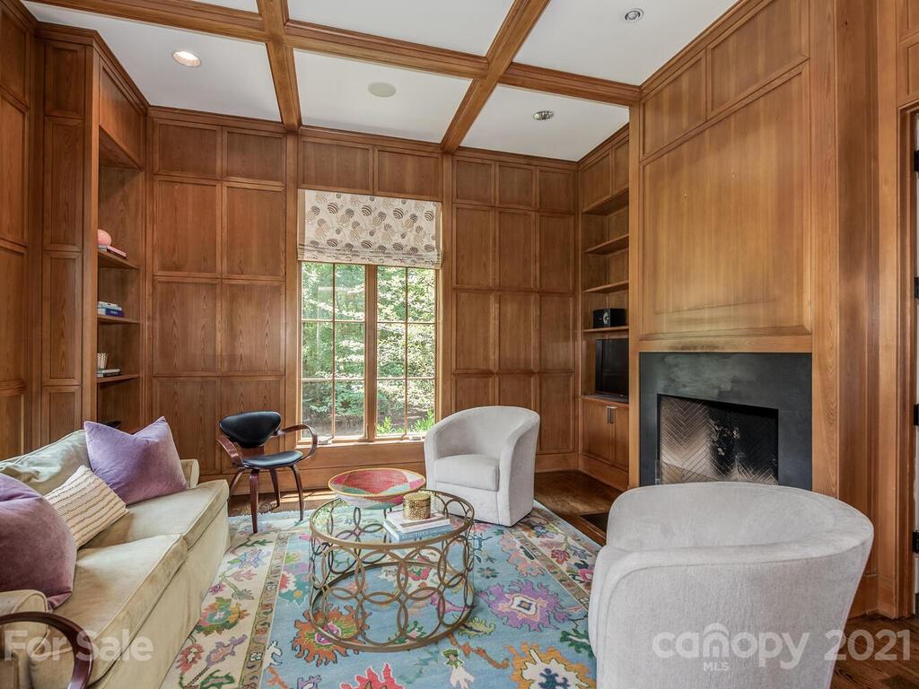 8424 Eagle Glen Charlotte, NC 28210 - Photo 13 of 48 a living room with furniture a fireplace and a table