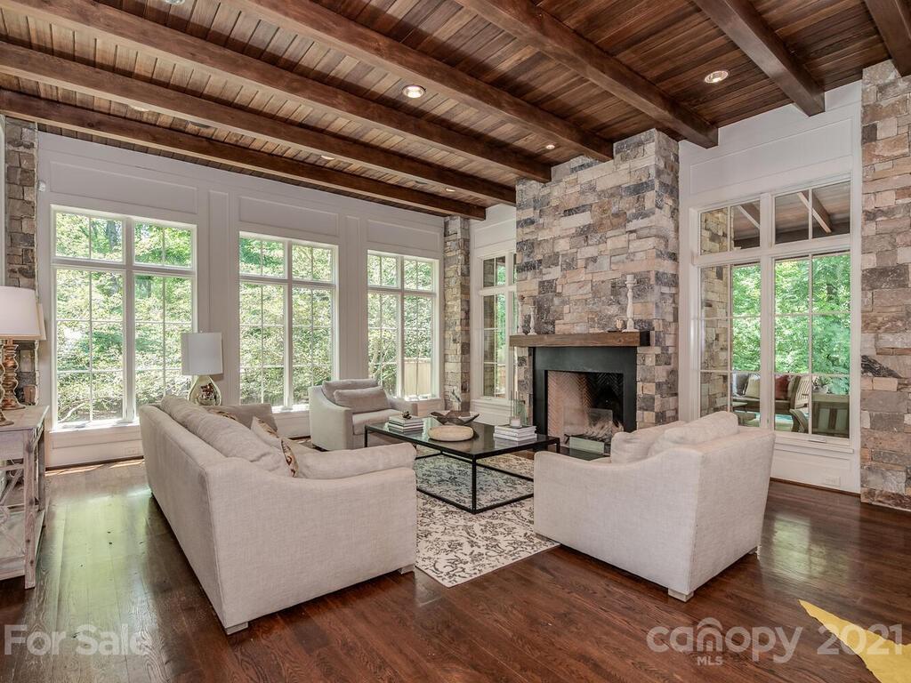 8424 Eagle Glen Charlotte, NC 28210 - Photo 15 of 48 a living room with furniture and a fireplace