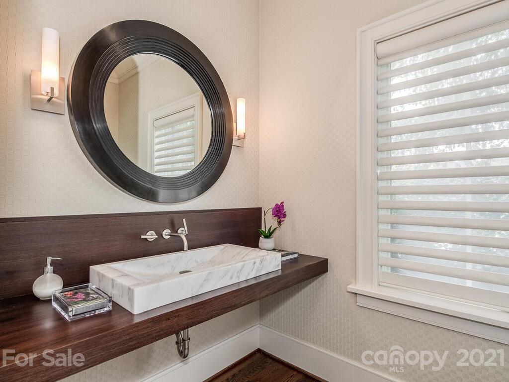 8424 Eagle Glen Charlotte, NC 28210 - Photo 24 of 48 a bathroom with a sink and a mirror