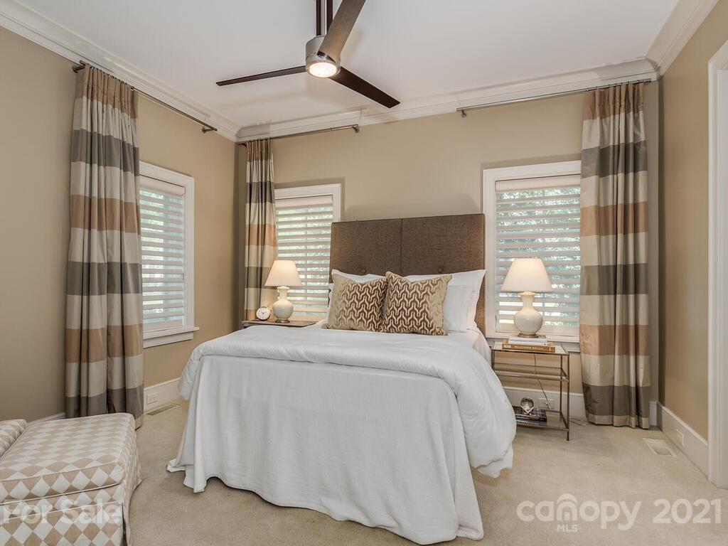 8424 Eagle Glen Charlotte, NC 28210 - Photo 25 of 48 a bedroom with a bed and a window