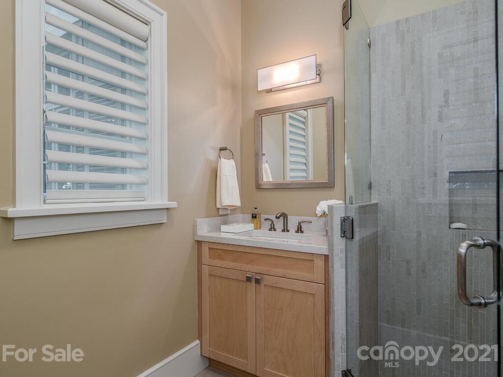 8424 Eagle Glen Charlotte, NC 28210 - Photo 26 of 48 a bathroom with a sink a toilet and a window