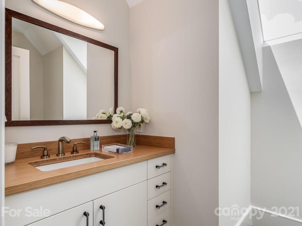 8424 Eagle Glen Charlotte, NC 28210 - Photo 30 of 48 a bathroom with a sink and a mirror