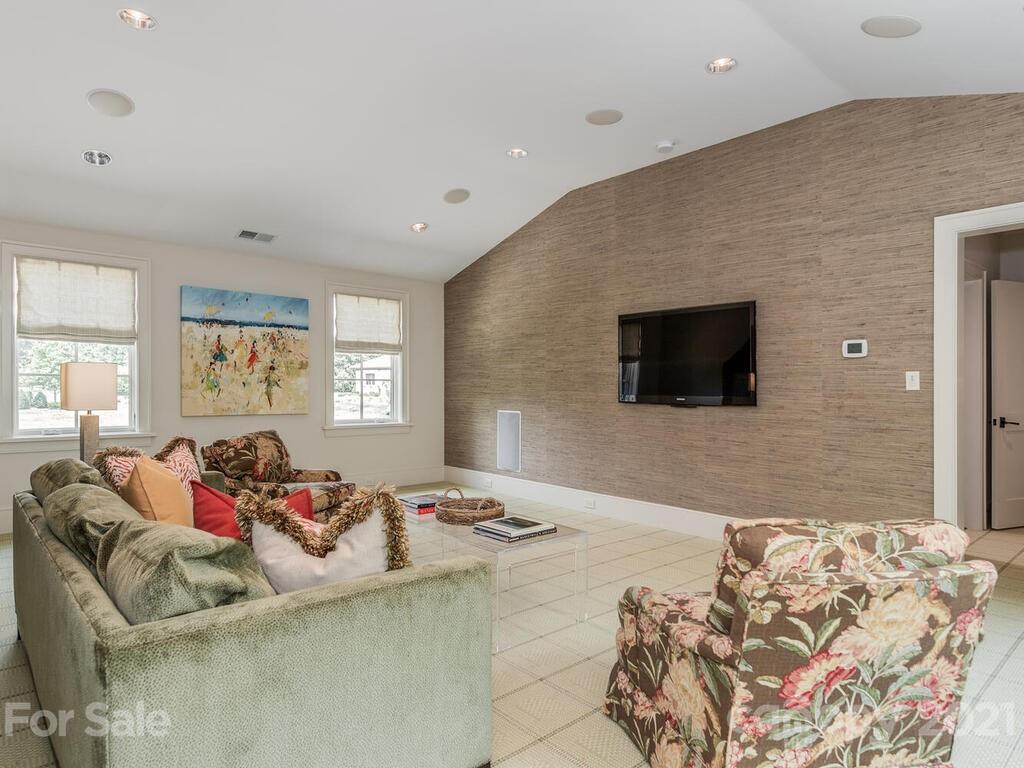 8424 Eagle Glen Charlotte, NC 28210 - Photo 32 of 48 a bedroom with a bed and a couch