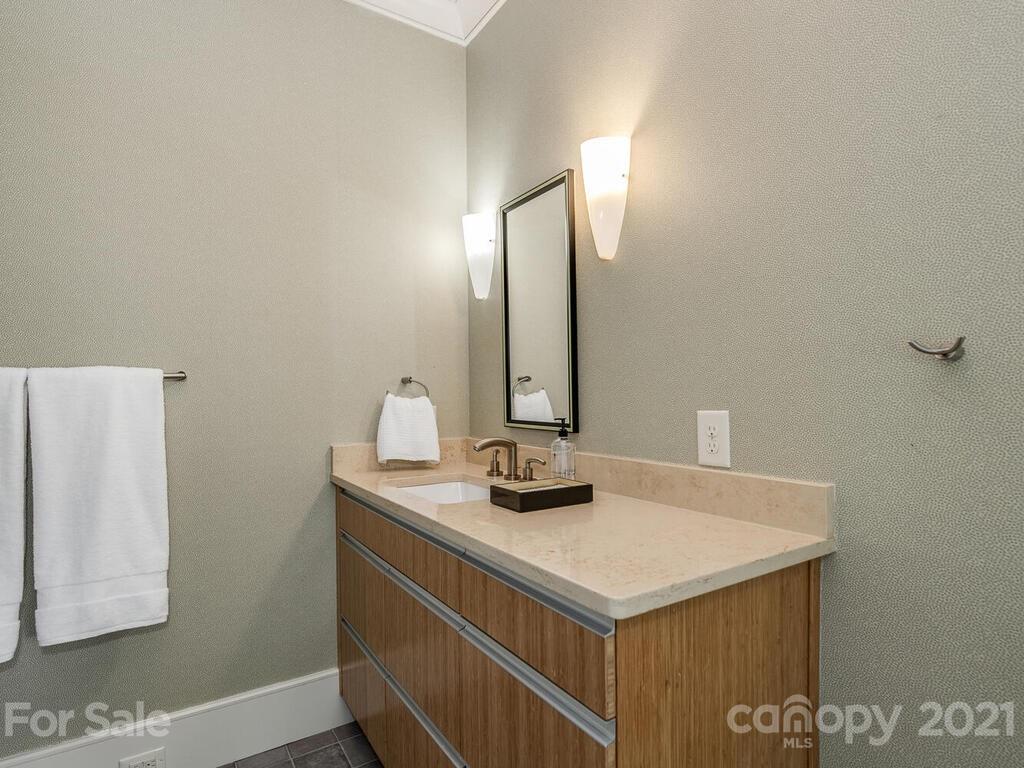8424 Eagle Glen Charlotte, NC 28210 - Photo 34 of 48 a bathroom with a sink and a mirror