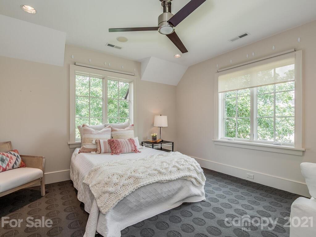 8424 Eagle Glen Charlotte, NC 28210 - Photo 35 of 48 a bedroom with a bed and a couch