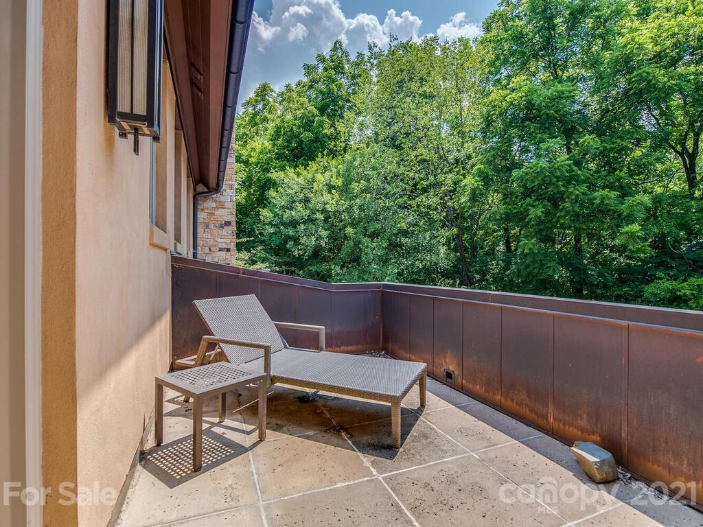8424 Eagle Glen Charlotte, NC 28210 - Photo 44 of 48 a view of balcony with outdoor seating and trees