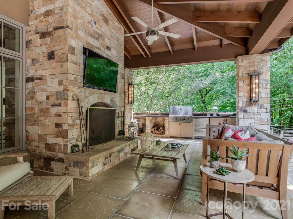 8424 Eagle Glen Charlotte, NC 28210 - Photo 47 of 48 a outdoor space with patio lots of furniture and a fireplace