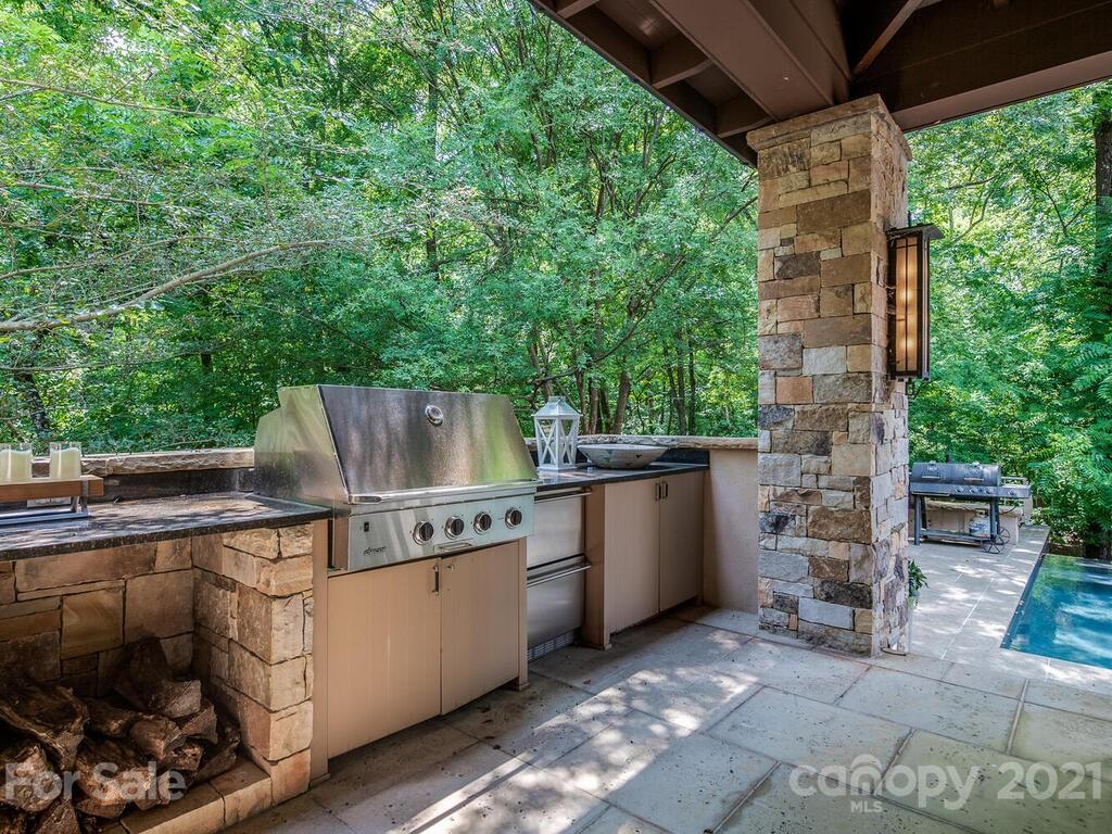 8424 Eagle Glen Charlotte, NC 28210 - Photo 48 of 48 a view of a patio with table and chairs with wooden floor and fence