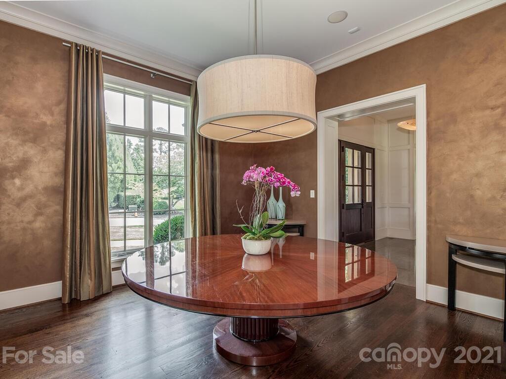 8424 Eagle Glen Charlotte, NC 28210 - Photo 10 of 48 a view of a dining room with furniture window and wooden floor
