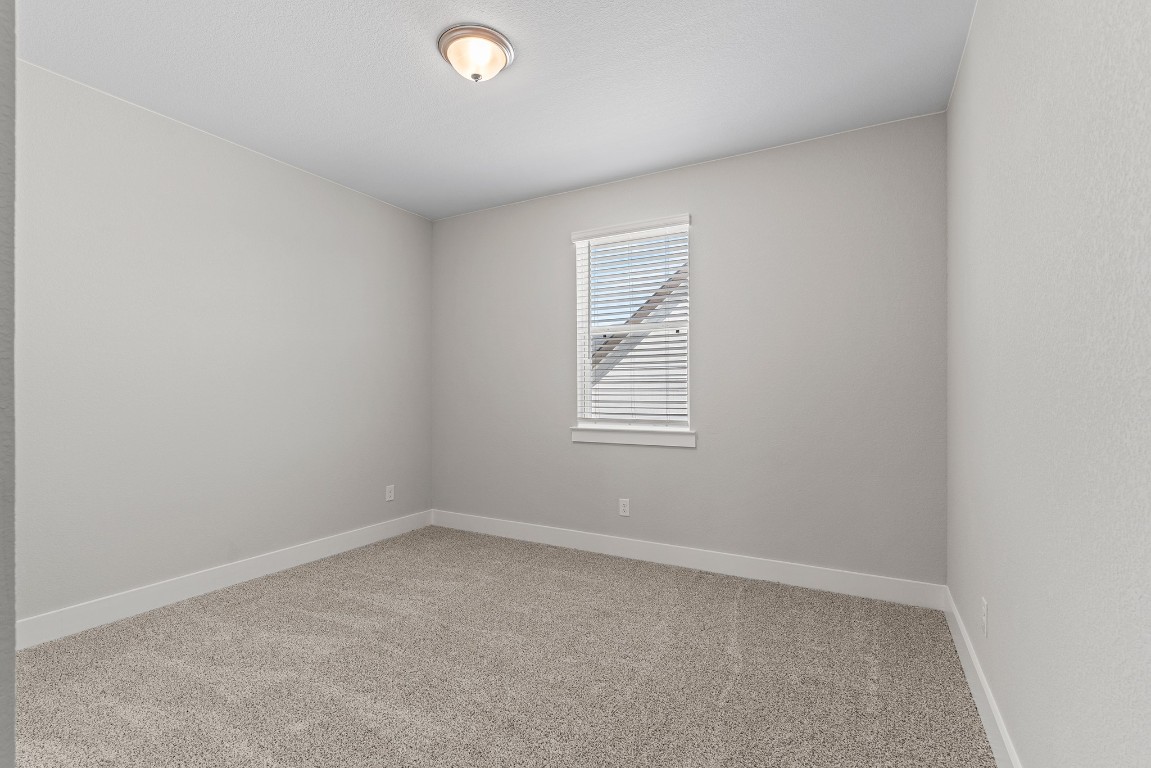 2112 Tobiano Trace Georgetown, TX 78633 - Photo 32 of 40 an empty room with windows