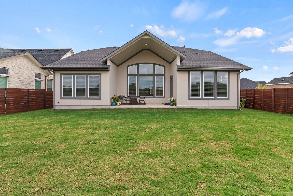 2112 Tobiano Trace Georgetown, TX 78633 - Photo 38 of 40 a front view of a house with garden
