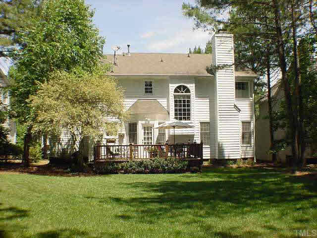8801 Attingham Drive Raleigh, NC 27615 - Photo 2 of 10 Incredible back yard and deck to enjoy it from. This is a very private and deep backyard, nicely landscaped