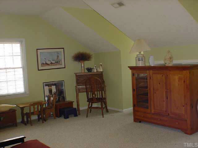8801 Attingham Drive Raleigh, NC 27615 - Photo 9 of 10 4th Bedroom/Bonus Roomm behind the hutch is the built in shelving/entertainment center