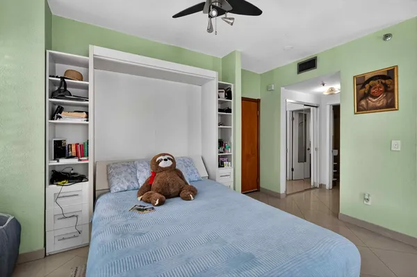 a bathroom with a glass door shower and a sink
