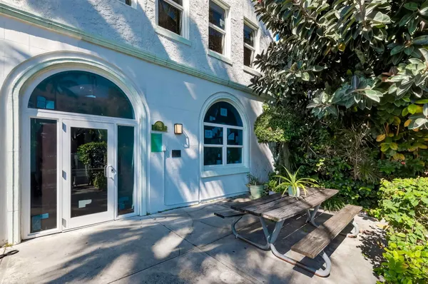 a view of a building with a tree