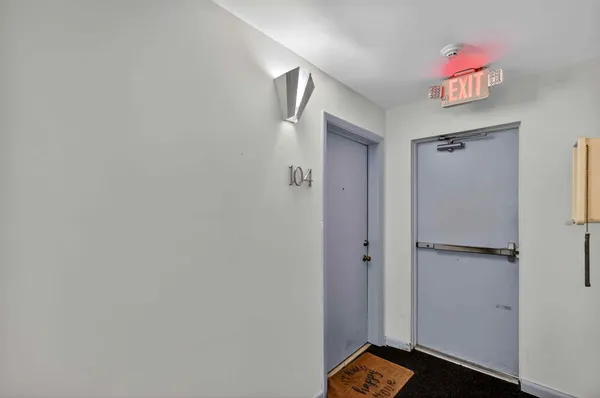 a view of an entryway with wooden floor
