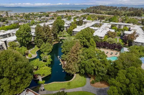 an aerial view of a house a yard and green space