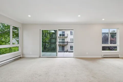 a view of an empty room with a balcony