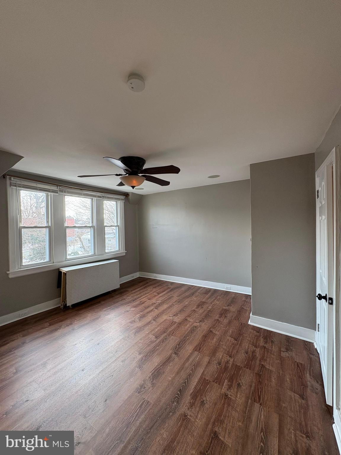 210 Wabash Avenue Lansdowne, PA 19050 - Photo 8 of 12 an empty room with wooden floor and windows