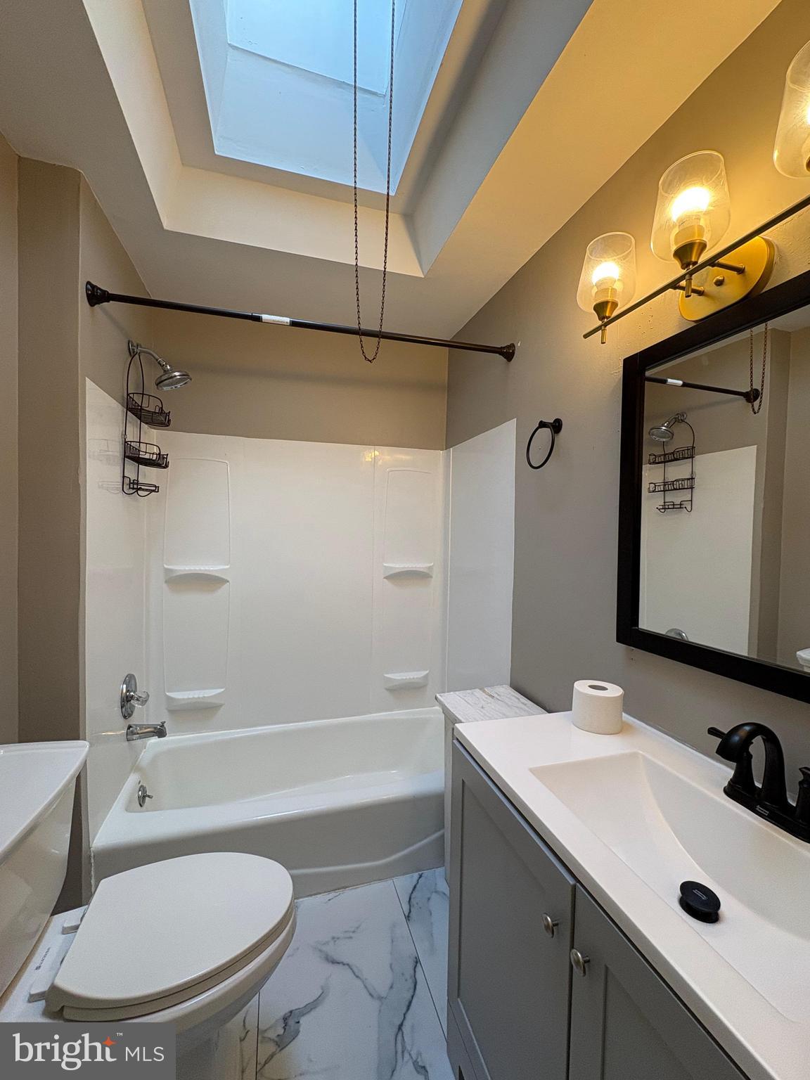 210 Wabash Avenue Lansdowne, PA 19050 - Photo 10 of 12 a bathroom with a sink a toilet and shower