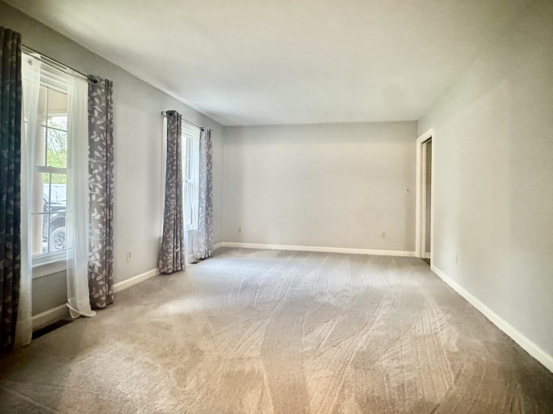 81 Middlebrook Street Harrisonburg, VA 22801 - Photo 4 of 22 an empty room with windows