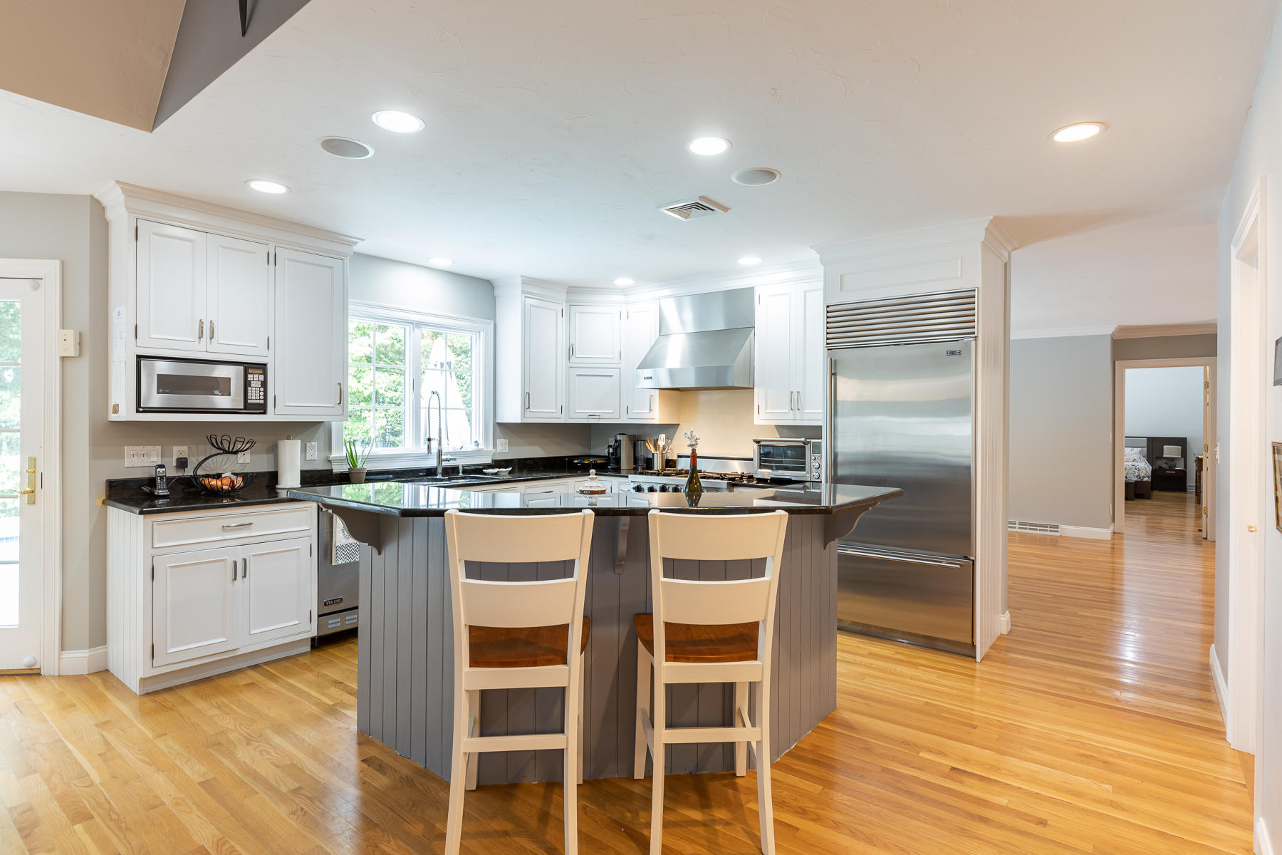 36 Topping Lift Mashpee, MA 02649 - Photo 12 of 38 a kitchen with stainless steel appliances granite countertop a stove top oven a sink refrigerator and cabinets