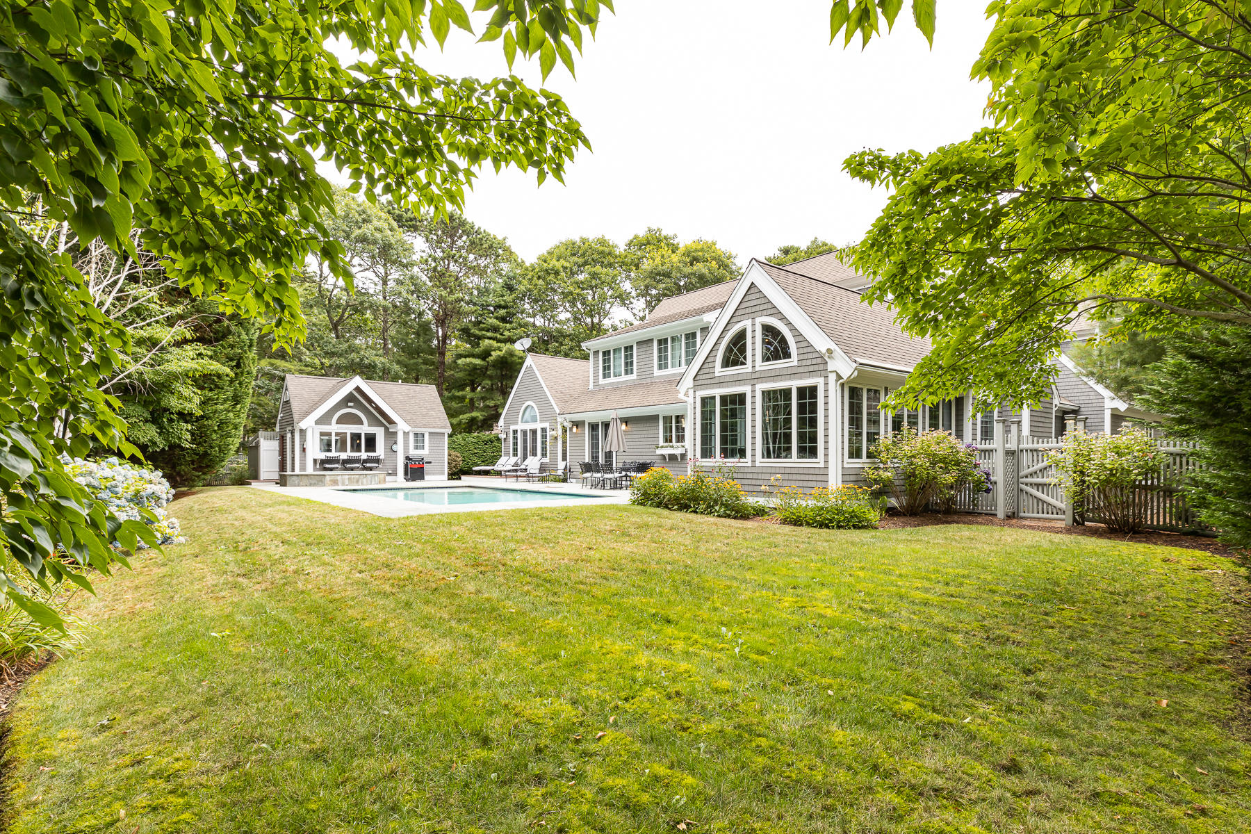 36 Topping Lift Mashpee, MA 02649 - Photo 2 of 38 a front view of a house with a garden