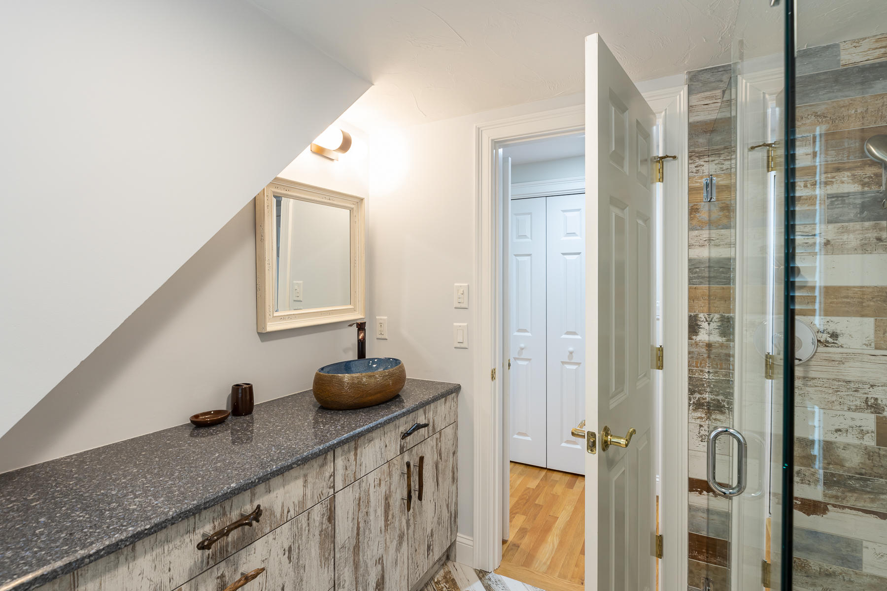 36 Topping Lift Mashpee, MA 02649 - Photo 26 of 38 a bathroom with a granite countertop sink a mirror and shower