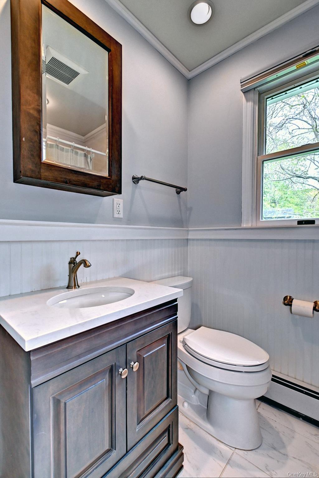 20 Valentine Road Shoreham, NY 11786 - Photo 16 of 39 Updated Bath w/Kohler Toilet and Wainscott half wall.
