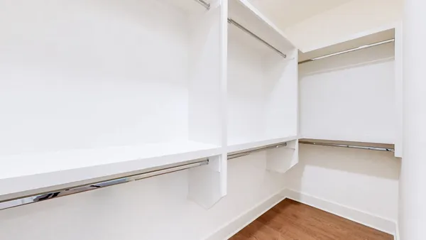 a view of an empty walk in closet