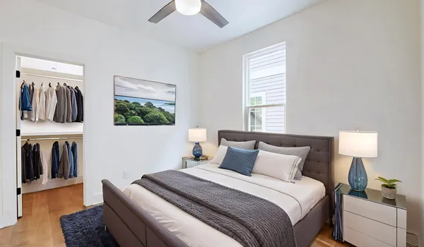 a bedroom with a bed and walk in closet