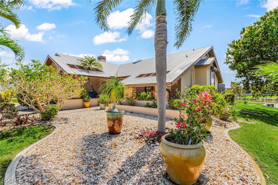 7747 Grande Pine Road Bokeelia, FL 33922 - Photo 7 of 45 a view of a backyard with garden and plants
