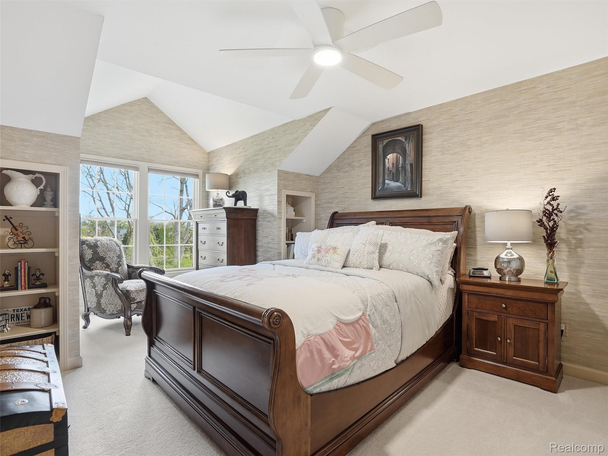 5211 Belmonte Drive Rochester, MI 48306 - Photo 26 of 40 Vaulted ceiling bedroom with light-toned textured wall covering, soft carpet flooring, and a ceiling fan with integrated lighting