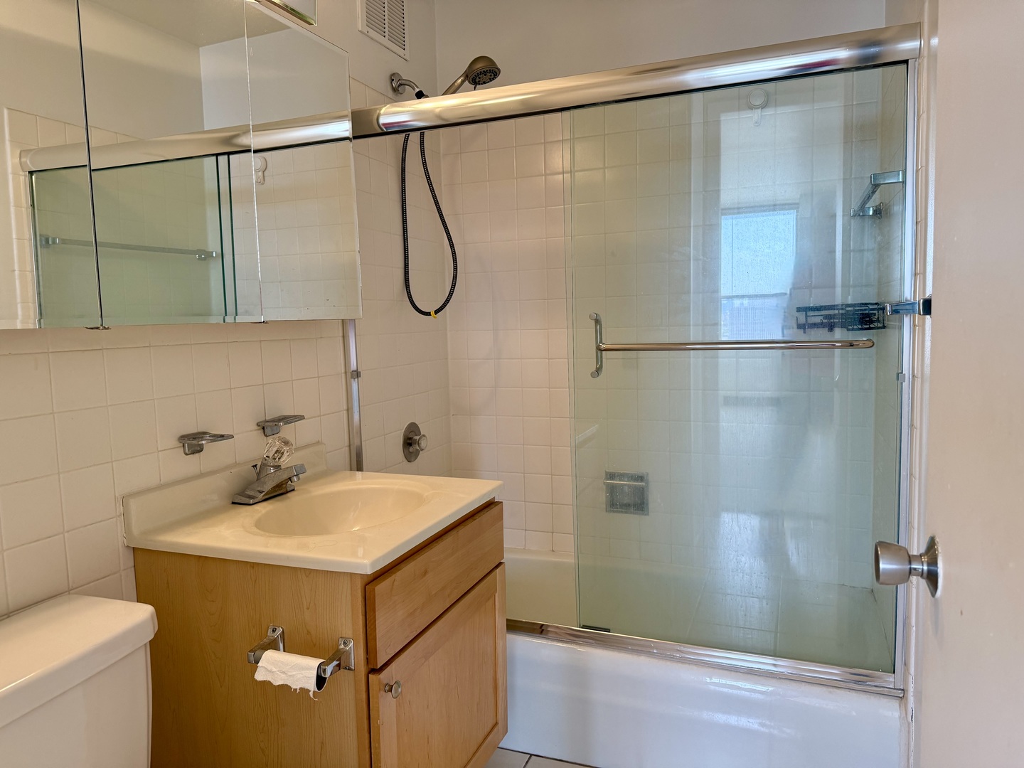 655 West Irving Park Road, Unit 1801 Chicago, IL 60613 - Photo 12 of 35 a bathroom with a sink and shower