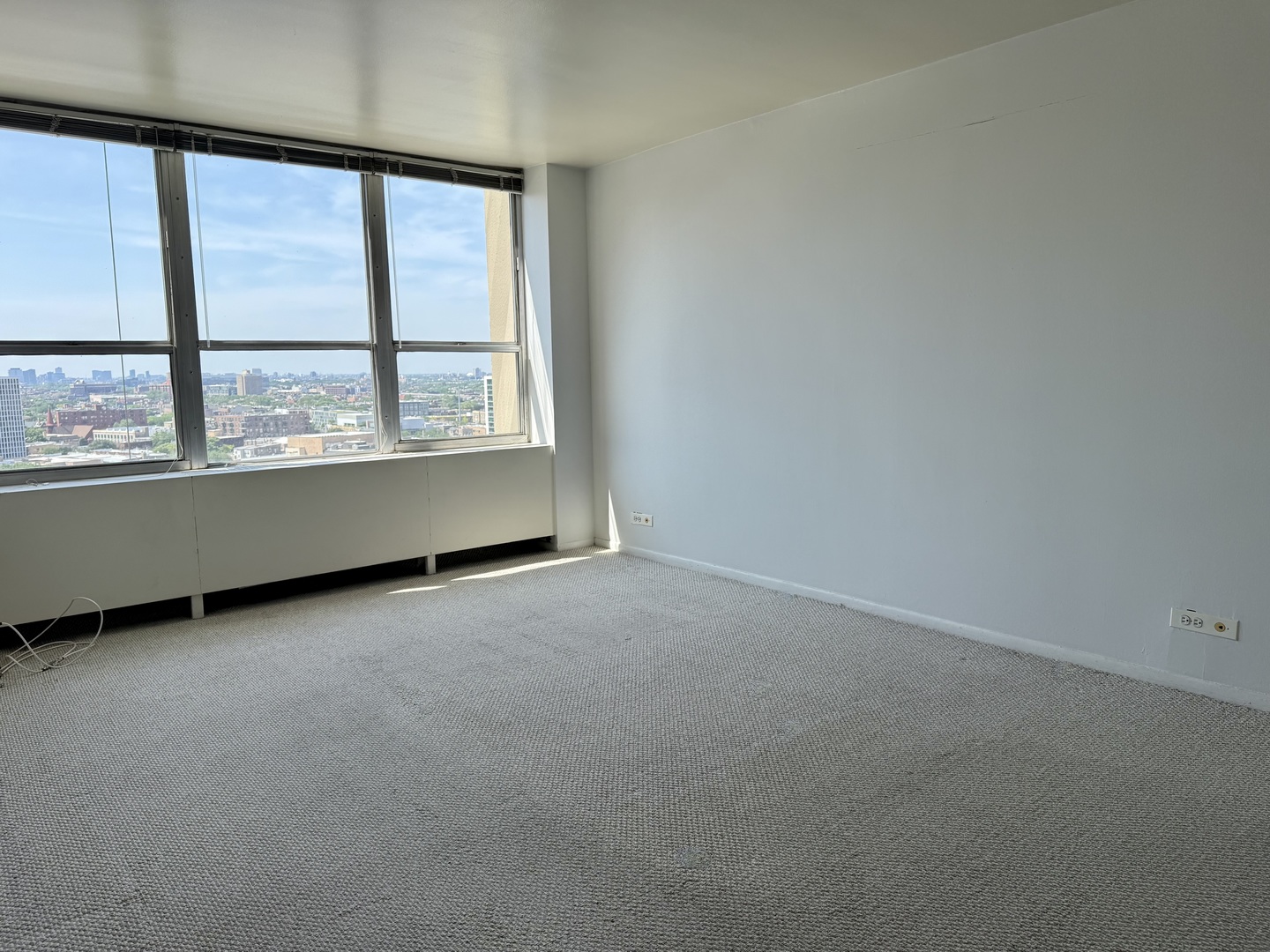 655 West Irving Park Road, Unit 1801 Chicago, IL 60613 - Photo 14 of 35 an empty room with a window