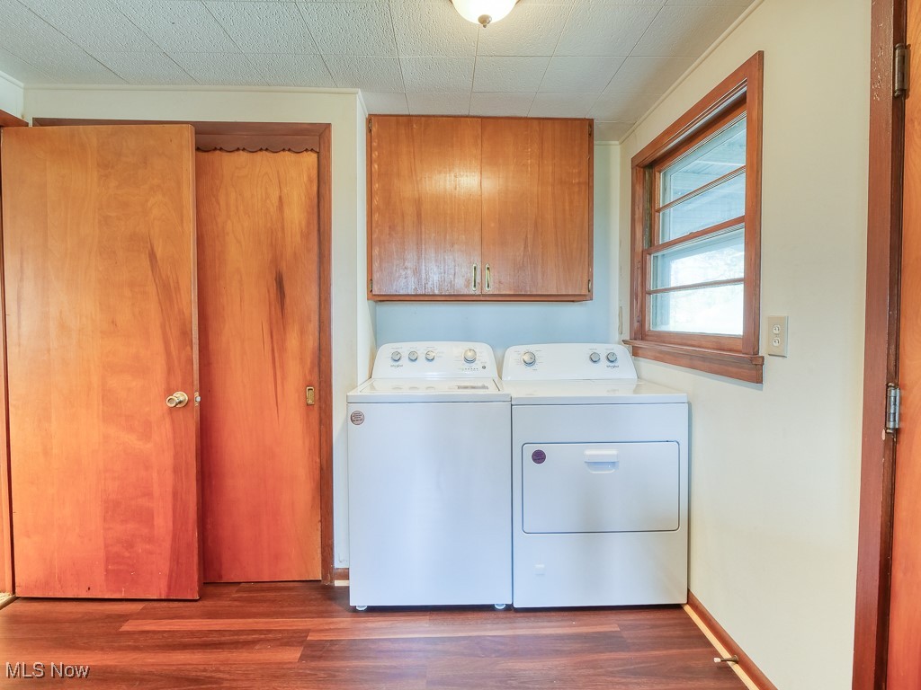27133 Capel Road Columbia Station, OH 44028 - Photo 20 of 48 Clothes washing area with cabinet space, dark wood finished floors, and washer and clothes dryer