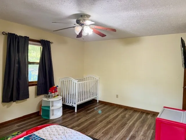 a kitchen with a sink refrigerator and microwave