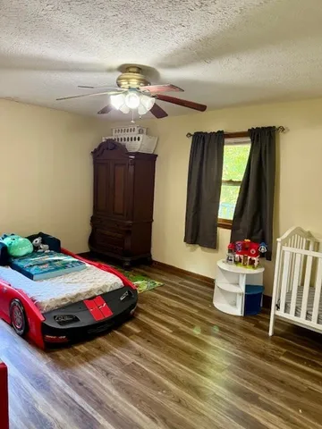 a kitchen with refrigerator and cabinets
