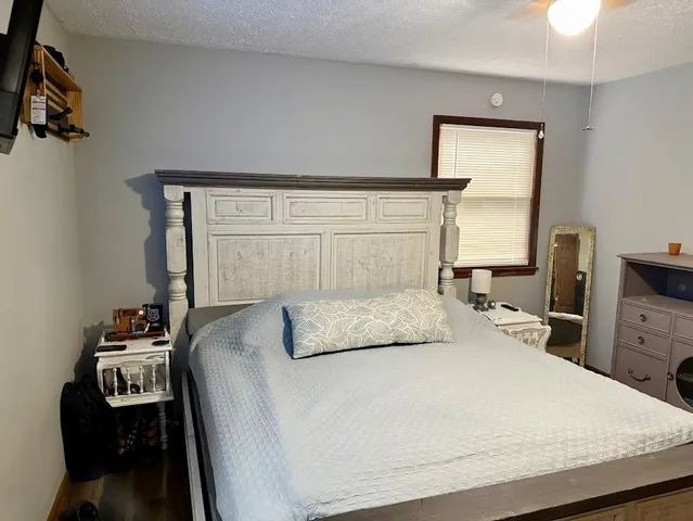 a bathroom with a sink toilet and shower curtain
