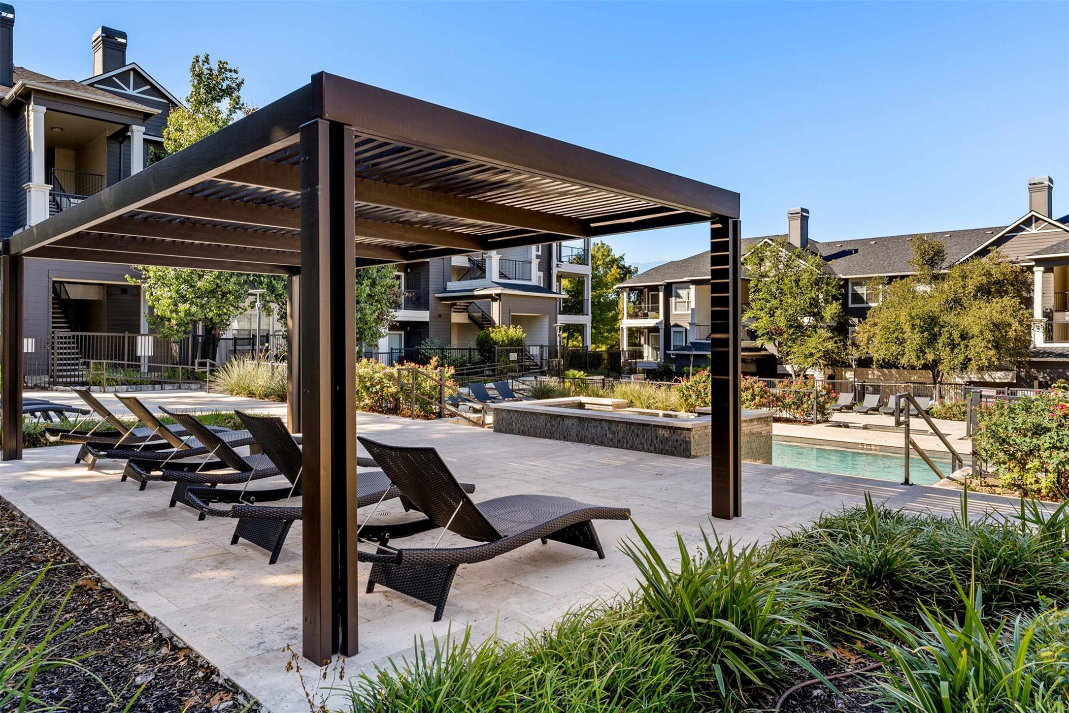 15450 Farm To Market Road 1325 Road, Unit 181838 Austin, TX 78728 - Photo 18 of 18 a view of a patio with table and chairs potted plants with floor to ceiling window
