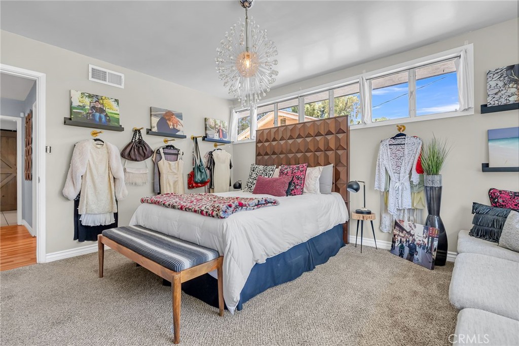 4231 Maplewood Place Riverside, CA 92506 - Photo 11 of 33 a bedroom with a bed and a table