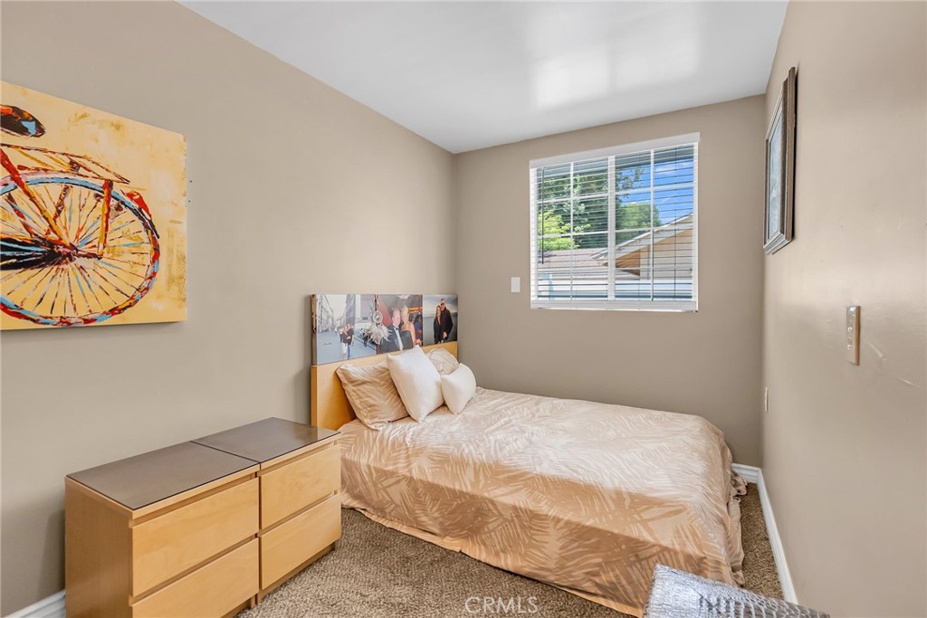 4231 Maplewood Place Riverside, CA 92506 - Photo 12 of 33 a bedroom with a bed and a window