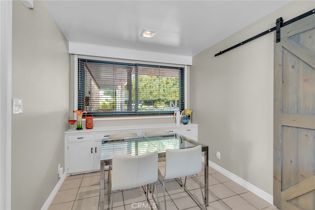 4231 Maplewood Place Riverside, CA 92506 - Photo 15 of 33 a dining room with furniture and window
