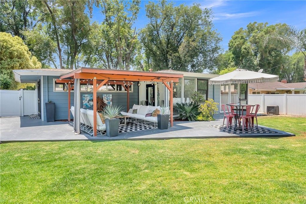 4231 Maplewood Place Riverside, CA 92506 - Photo 23 of 33 a view of a chair and table in backyard of the house