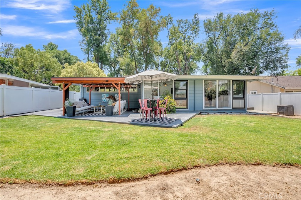 4231 Maplewood Place Riverside, CA 92506 - Photo 24 of 33 a view of a swimming pool with an outdoor seating